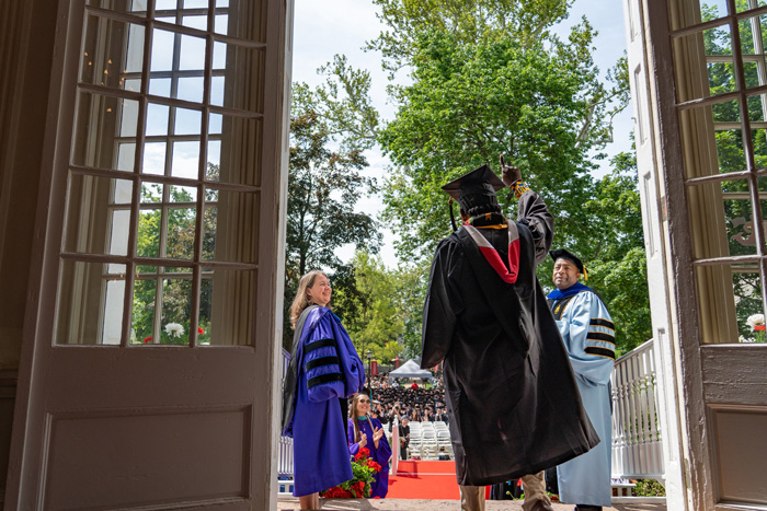 Student walks down old stone steps