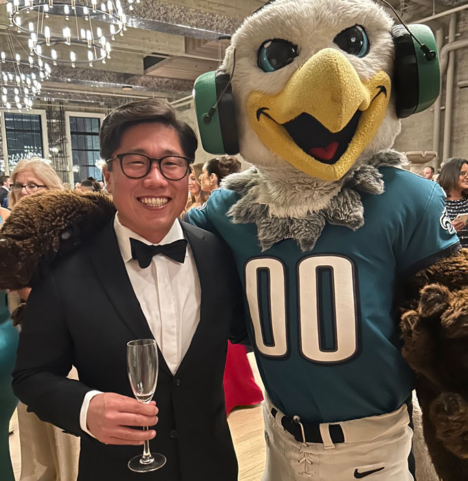 Jason Yi with the Eagles mascot