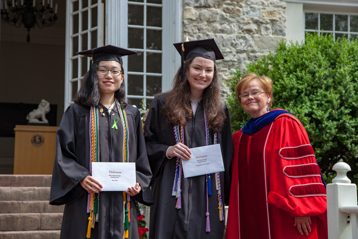 Moyi Tian ’19, the James Fowler Rusling Prize winner, and Mary Katherine Levangie ’19, the winner of the John Patton Memorial Prize for High Scholastic Standing, pose with Dickinson President Margee Ensign.