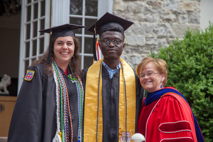 Hufstadter Prize winners Olivia Termini and John Adeniran pose with Dickinson President Margee Ensign.