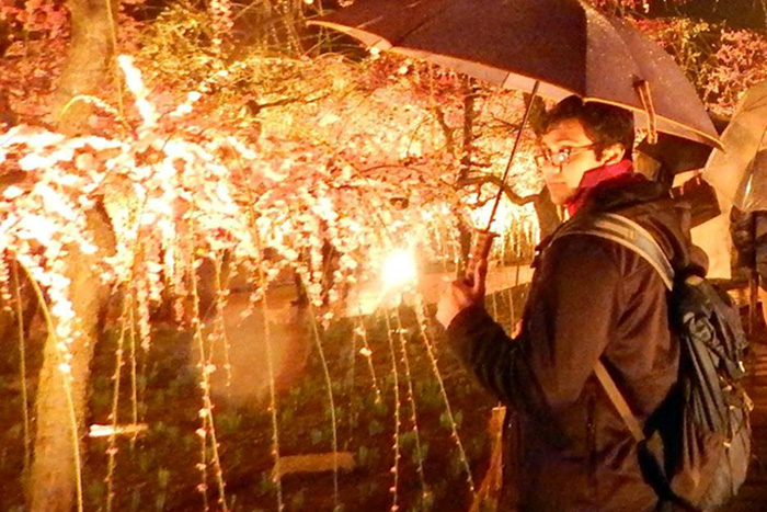 Asir Saeed in a nighttime garden