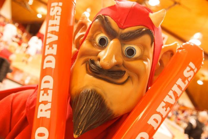 the red devils' mascot celebrates