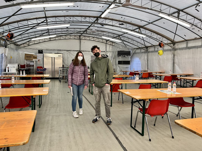 While studying abroad in Italy, Mary Ritter '23 (left) and James Marks '23 volunteered for soup kitchens in Bologna.