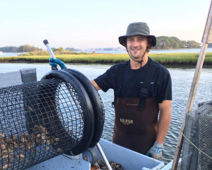 brad boehringer '13 at his oyster farm