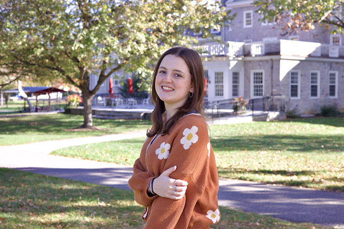 a young woman outdoors, smiling