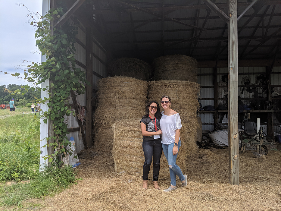 Valeria Carranza '09 (left) and wife Lauren Carranza, during a 2019 tour of the College Farm.
