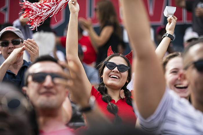 Fans cheer during a Dickinson homecoming game.