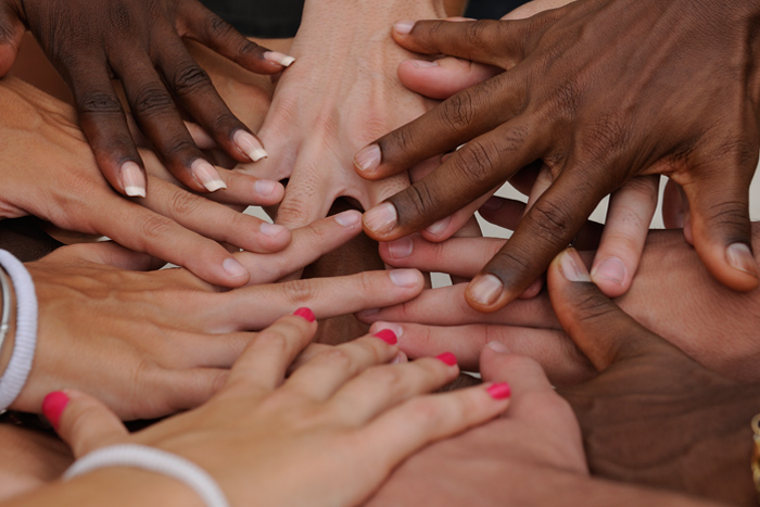 Hands in a huddle.