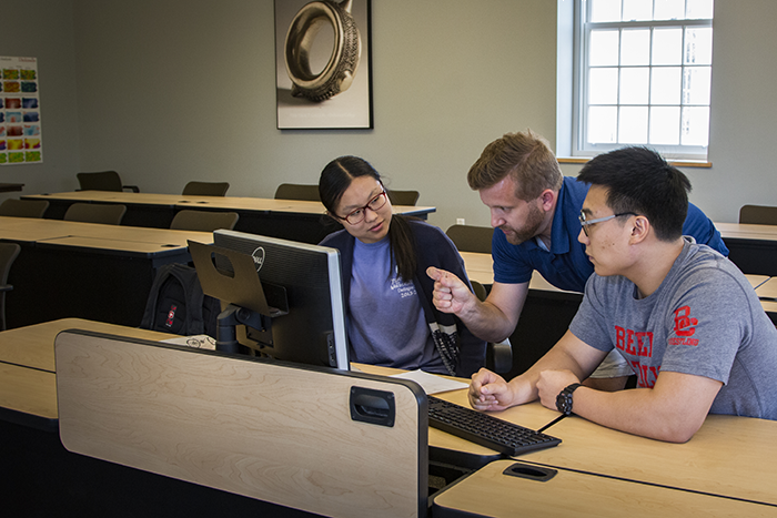 Professor Anthony Underwood with former student researchers Daniel Byun '19 and Yanqing Zhao '19