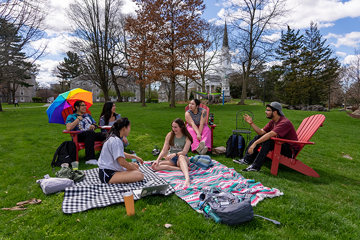 Students hang out on blankets at Morgan Field