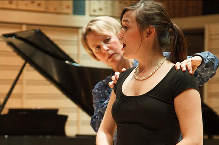 Associate Professor of Music Lynn Helding works with music major Holly Kelly '15.