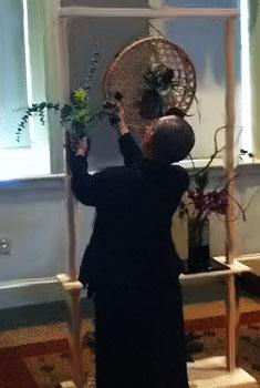 Picture of Anna Nakada arranging flowers during a demonstration