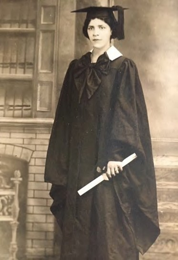 A photograph of Dickinson Alumnus Esther Popel Shaw dressed in graduation robes and cap