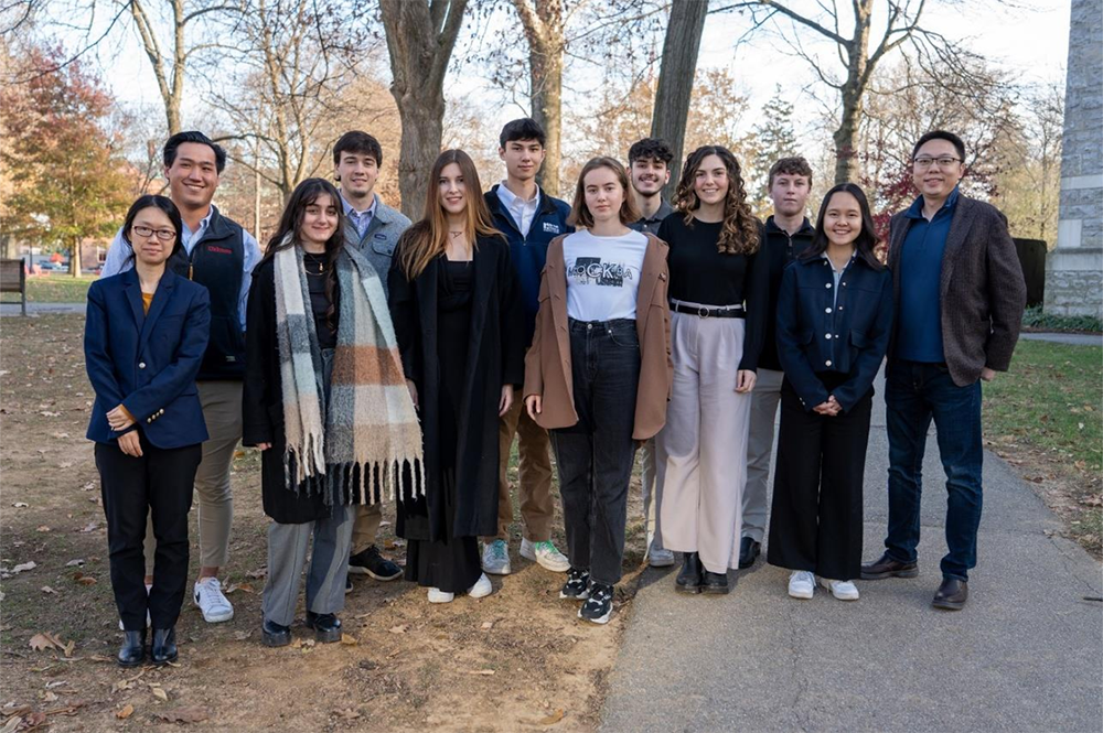 2023 Investment Competition photo featuring Professor Qing Bai (first from the left, Finance and INBM), Professor Mengnan Zhu (first from the right, Finance and INBM), and the Student Winners