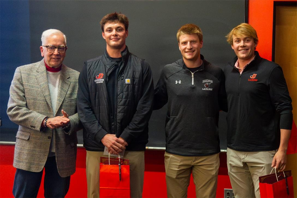 2025 Investment Competition photo featuring President John E. Jones III ’77, P’11, and the Student Winners