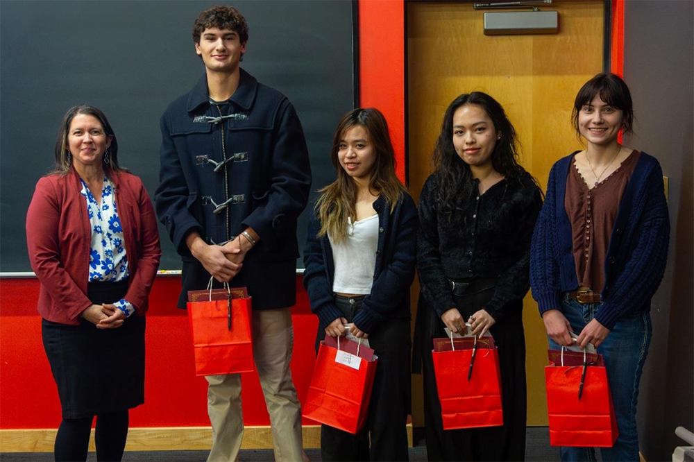 2025 Investment Competition photo featuring Provost &amp; Dean of the College Renée Cramer, and the Student Winners