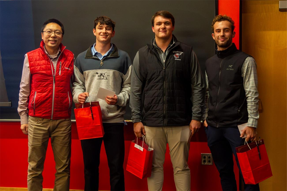 2025 Investment Competition photo featuring Professor Mengnan Zhu (Finance and INBM), and the Student Winners
