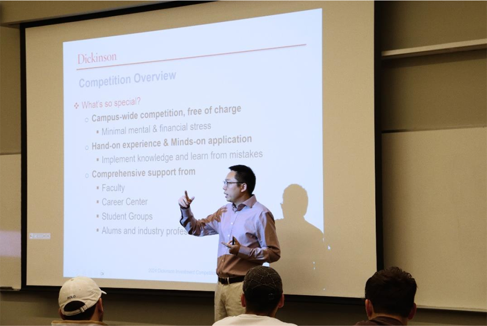 2024 Investment Competition photo featuring Professor Mengnan Zhu (INBM and Finance) explained the Investment Competition at its kickoff event