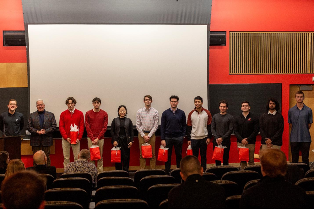 2024 Investment Competition photo featuring President John E. Jones III ’77, P’11, and the Student Winners