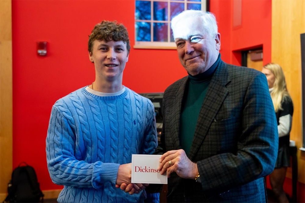 2023 Investment Competition photo featuring President John E. Jones III ’77, P’11, and the First-Place Winner