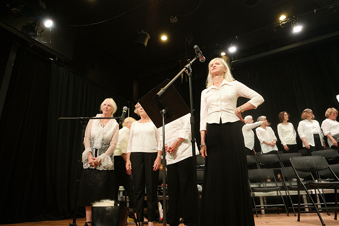 Kathryn Engle '71 (far right) performs onstage.