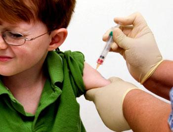 Photograph of child receiving a shot