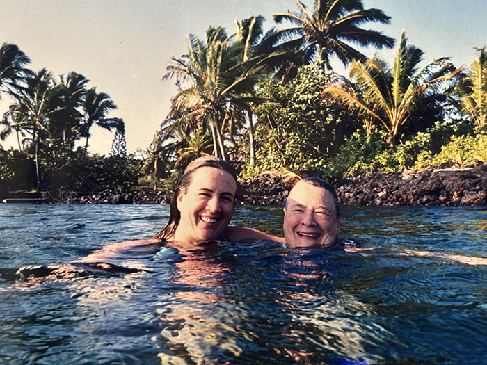 Two women, swimming.