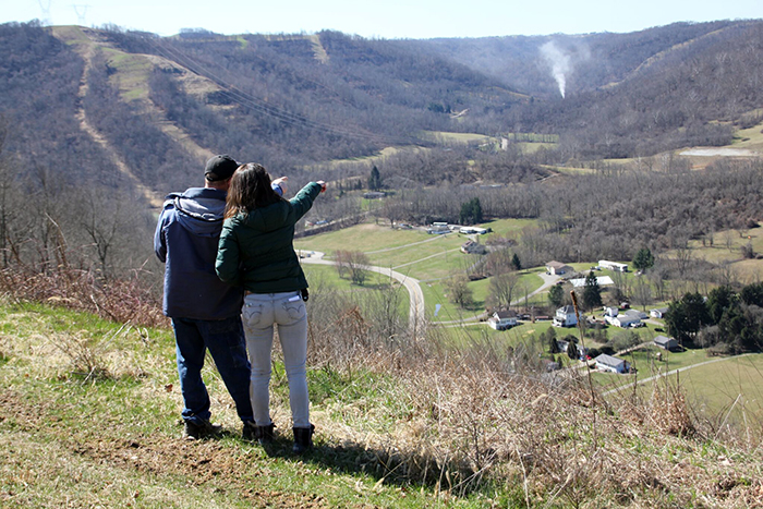 Leann Leiter '08 (right) in the field, with a local resident who wanted to learn more about the environmental effects of fracking near his home.