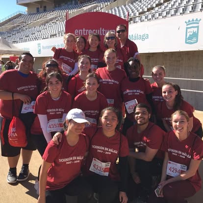Málaga Director Mark Aldrich poses with students before a 5K run