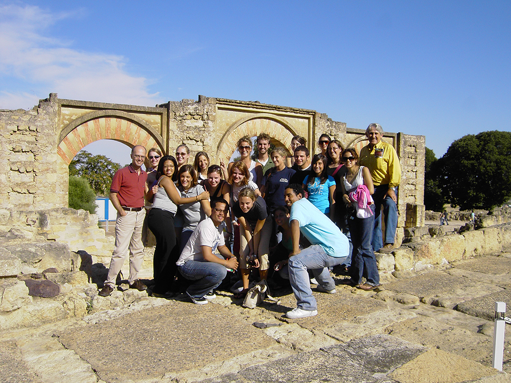 Malaga Director Marcelo Borges and students take a large group photo at a Spanish historical site in Fall 2006