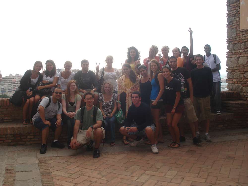 Malaga Director Marcelo Borges poses with students outside in Fall 2009