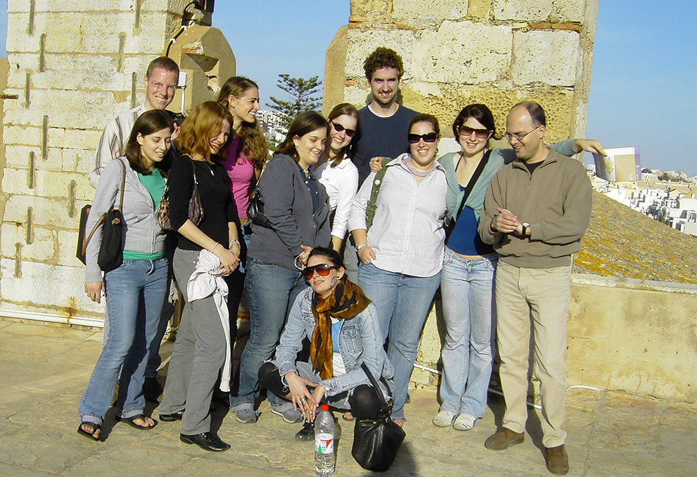 Malaga Director Marcelo Borges poses with students at a Spanish historical site in Spring 2007