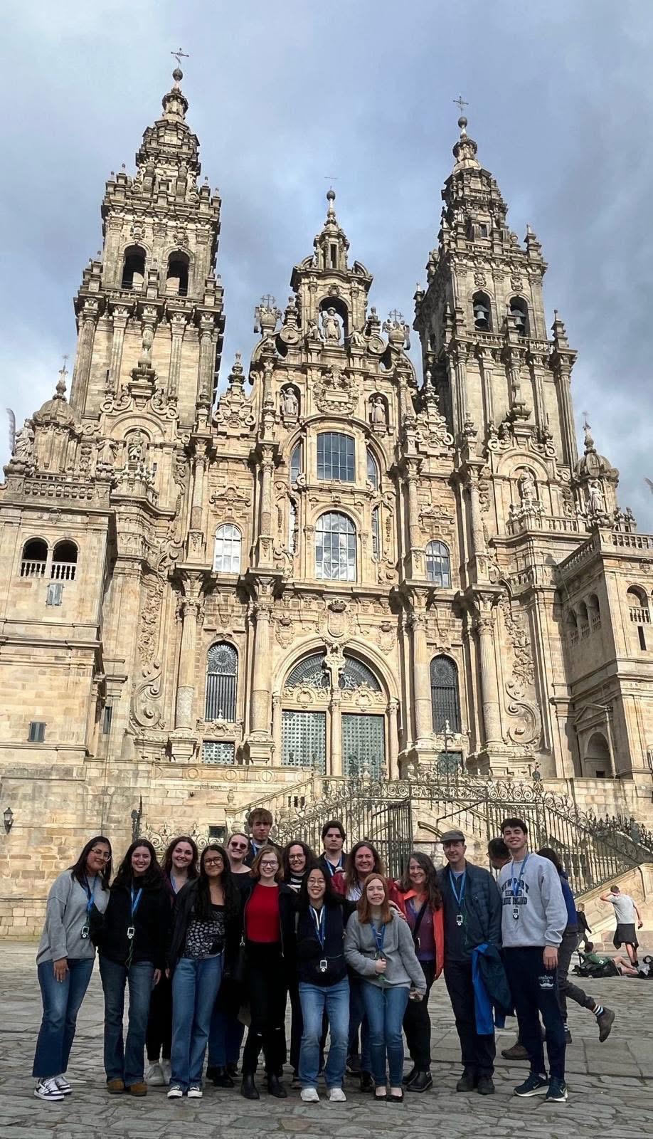 Malaga Program Director Margaret Frohlich captures a photo with students outside of a cathedral in Spain