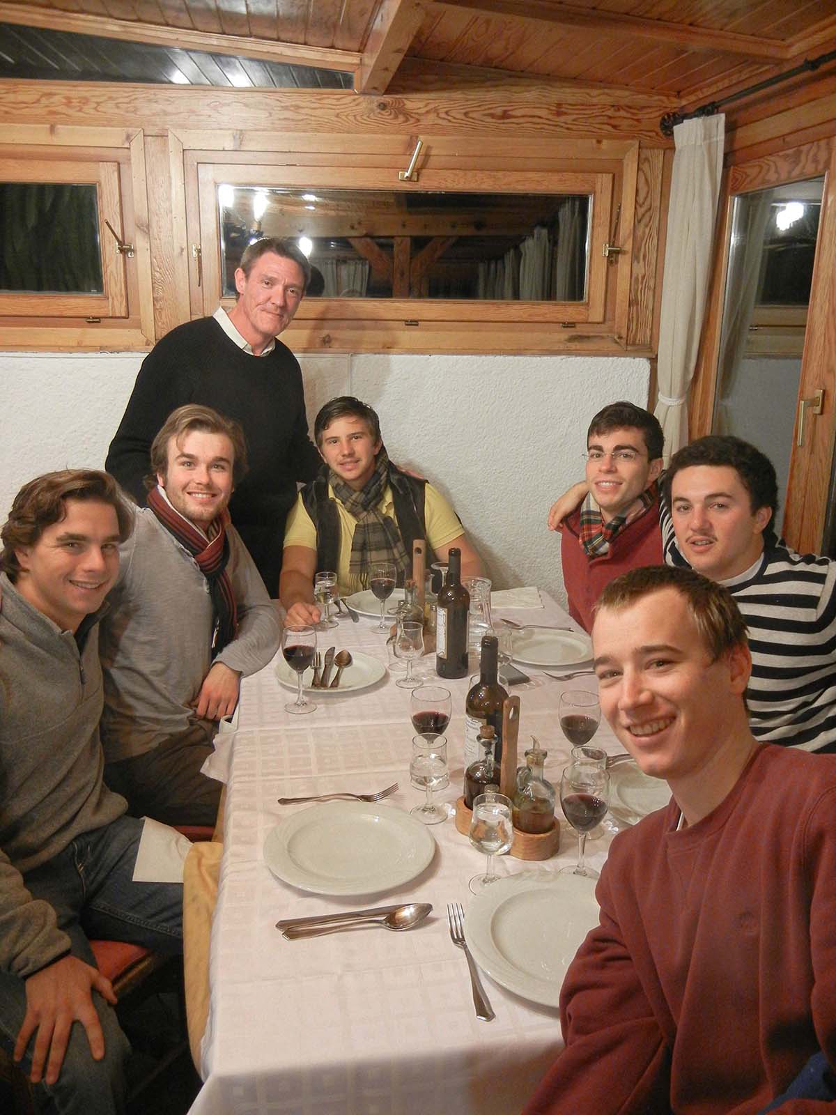 Málaga Director Jorge Sagastume with students at dinner