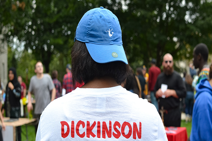 A student is wearing a cap which represents the Mermaid Society.