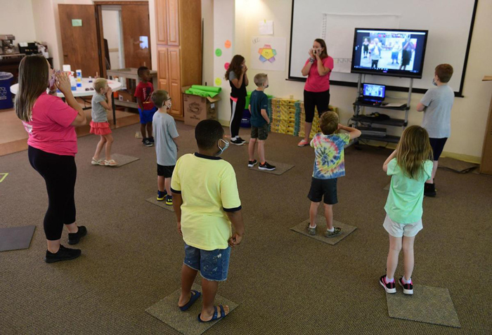 Summer Program for Youth Campers and staff practice proper social distancing during morning session.