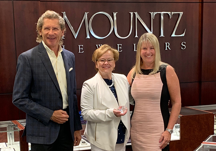 Mountz Jewelers co-owners Ron Leitzel and Tonia Leitzel Ulsh present President Margee Ensign (center) with the Inspire 40 Award. (center) with the Inspire 40 award, recognizing leaders in Central Pennsylvania who inspire.