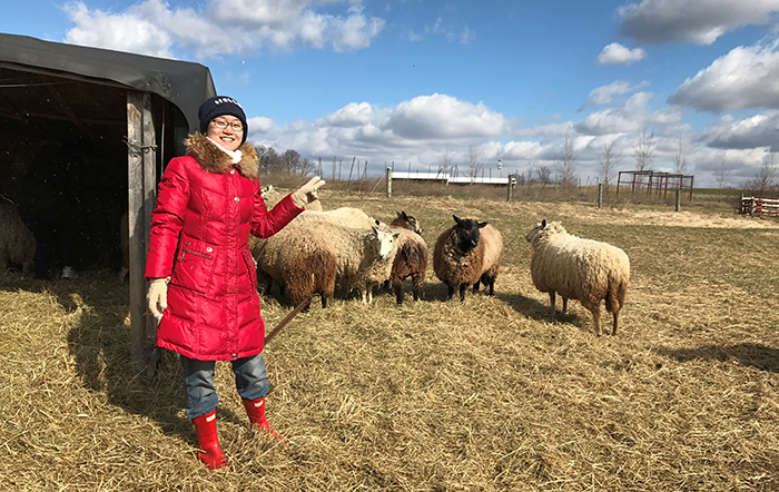 Moyi Tian '19 at the College Farm.