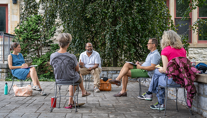 Music faculty meeting outside