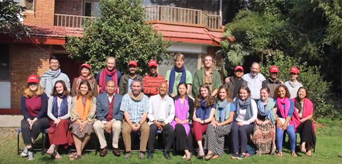 Students and professors in the Nepal Mosaic pose for a group shot with local graduate students during their trip to Nepal.