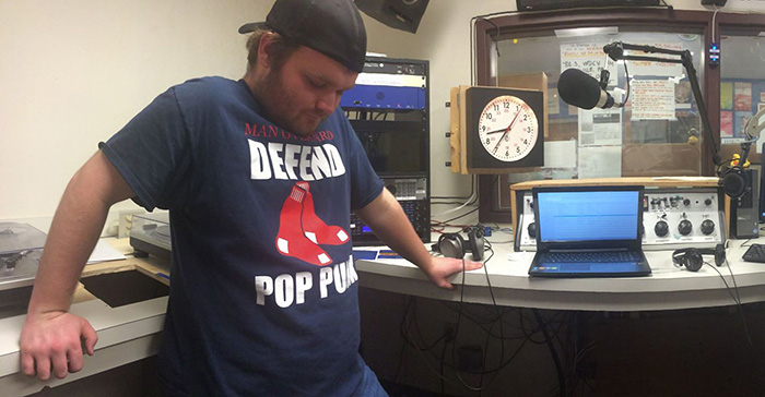 WDCV station manager/DJ Jon Northridge '16 listens to music during his radio show.