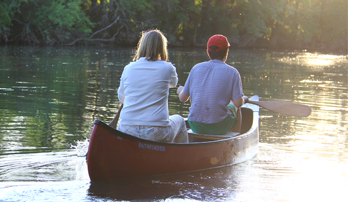 a photo of two students in a boat 