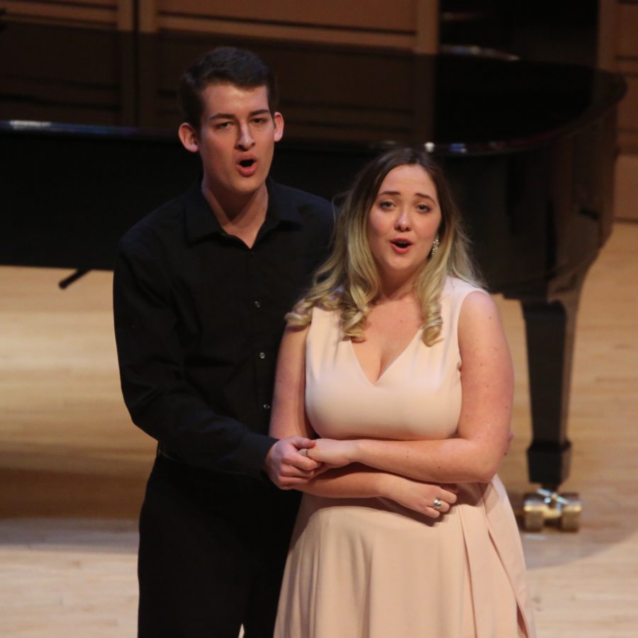 two opera singers, singing in front of a piano in Rubendall Recital Hall
