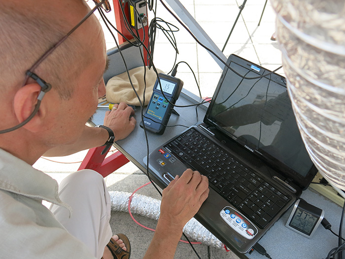 Hans Pfister works on a prototype of a solar-air heater.