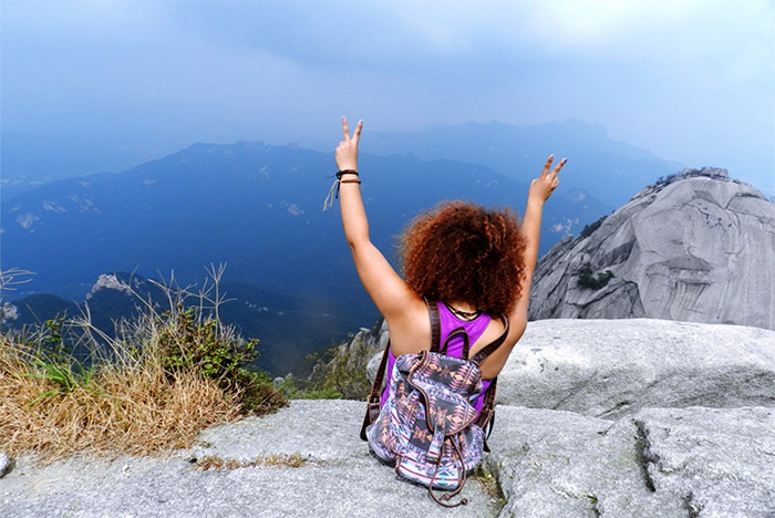 Nicole Price '15, a biochemistry & molecular biology major, at the top of Bukhansan Mountain, Seoul, Korea.