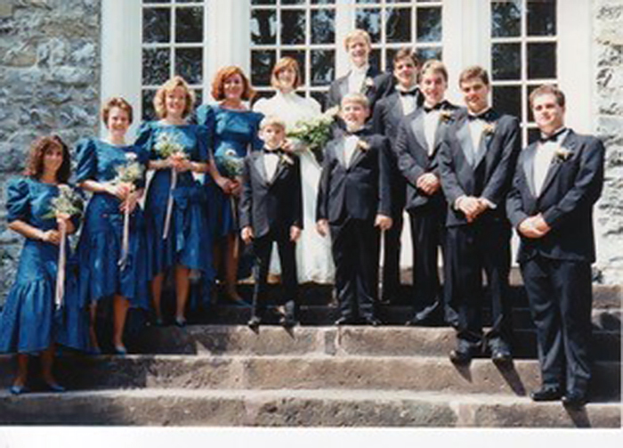 Tom '92 and Tania '92 Pineo, on their wedding day, in front of Old West.