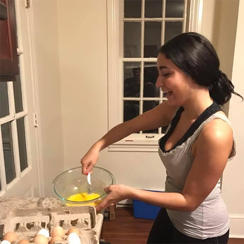 Spanish Student cooking a traditional dish in Dickinson's Romance Language House