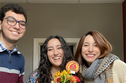 Three Dickinson Spanish students taking a picture in the Romance Language House