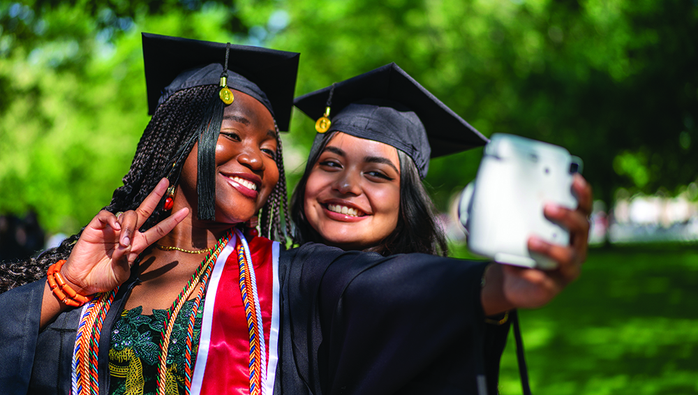 Students taking a selfie at graduation