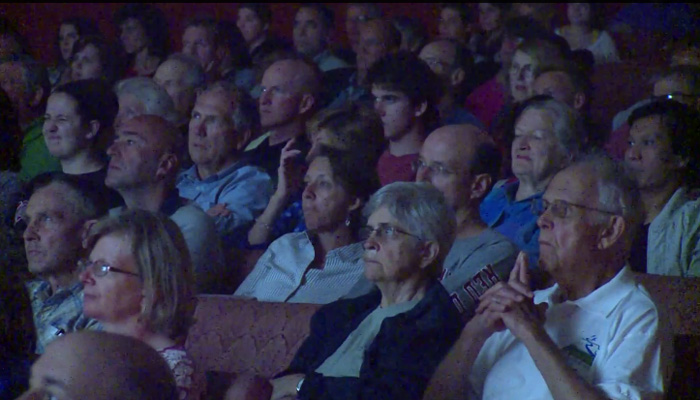 A crowd in a movie theatre.